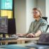 Male Data Scientist Coding on Desktop Computer in Creative Office Space. Caucasian Man Scraping Digital Information From Opened Sources in Internet For Artificial Inteligence Software Development.
